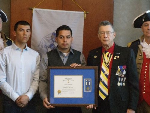 On behalf of the National Society of the Sons of the American Revolution and the George Washington Birthday Celebration Committee, the Harry S. Truman Chapter awarded Mr. Julio Gonzalez with the Medal for Heroism at the 356th Meeting on Saturday, March 14, 2015.   President Robert L. Grover and the Harry S. Truman Chapter Color Guard officiated during the ceremony.  All Harry S. Truman Chapter members congratulated Mr. Julio Gonzalez after the presentation.