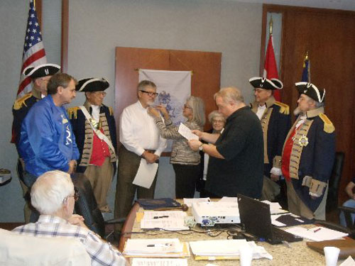President Donald Lewis and the Harry S. Truman Color Guard, are shown here conducting a New Member Induction for Compatriot Larry Tatum, who was inducted into the SAR for his ancestor Patriot Casper Miesse. Patriot Casper Miesse was a Private 5th Class with the Second Battalion in Lanscaster County, PA. Compatriot Tatum was presented with his membership certificate, membership rosette, chapter challenge coin, and welcome packet by President Donald Lewis, sponsor Compatriot Dirk A. Stapleton and Compatriot Larry Tatum's wife.
