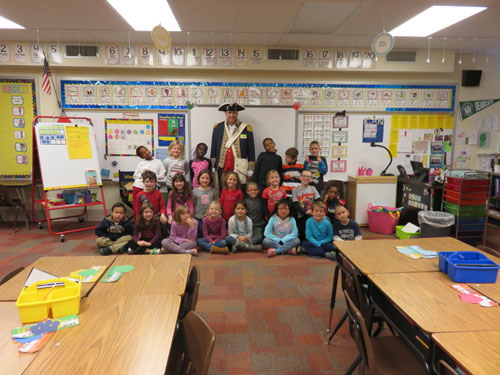 
Pictured here is Compatriot Roy Hutchinson, a member of the Harry S. Truman Chapter Color Guard, during a school presentation with first graders at Line Creek Elementary in Park Hill School District on Veterans Day 2014.