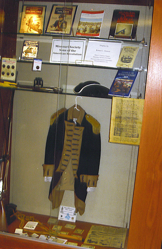 Pictured here is The Harry S. Truman Chapter Color Guard exhibit currently on display on Saturday, June 20, 2009, during an opening exhibit, at the Midwest Genealogy Center located at 3440 S. Lee's Summit Road in Independence, MO.  The articles on display include American Revolution uniforms, weapons and other artifacts.  The display also includes information about the National Society Sons of the American Revolution.