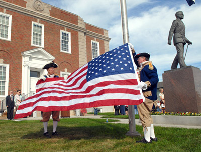 The Harry S. Truman Color Guard is shown here preparing to raise the newly dedicated U.S. Flag at the Jackson County Truman Courthouse, donated by the Independence Pioneers Chapter, Daughters of the American Revolution. Major General Robert L. Grover, MOSSAR Color Guard Commander; and Captain James L. Scott are shown here participating in this ceremony.