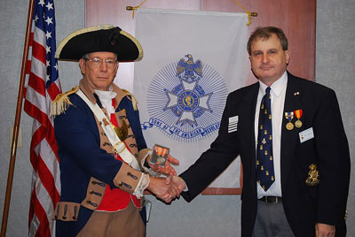 The Harry S. Truman Chapter awarded two Compatriots for their tireless efforts at both the Chapter and State of Missouri level.  MOSSAR Color Guard Commander Robert L. Grover is shown here with President Dirk A. Stapleton, after receiving the Silver MOSSAR award