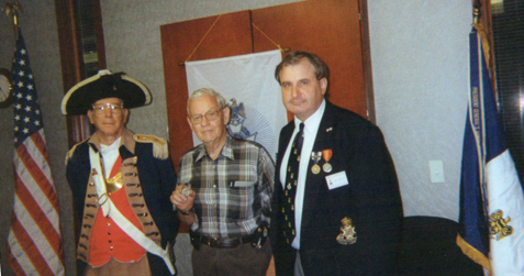 The Harry S. Truman Chapter Color Guard is shown here during the presentation of the First Harry S. Truman Chapter coin.  The Harry S. Truman Chapter coin is being presented to David Mccann by President Dirk Stapleton and MOSSAR Color Guard Commander Robert L. Grover.