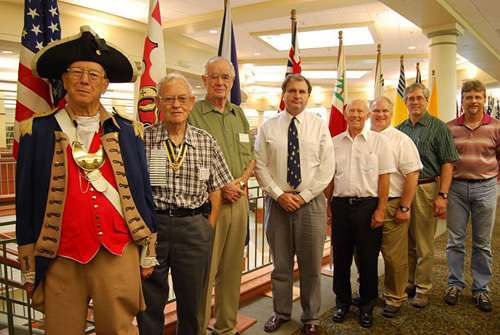 The Harry S. Truman Chapter conducted a Genealogy Workshop on Saturday, September 11, 2010 at the at the Midwest Genealogy Center in Independence, Missouri.  Genealogist David McCann conducted the Genealogy Workshop.  Harry S. Truman Chapter members are shown here near the Harry S. Truman Chapter flag display located on the 2nd floor of the library.
