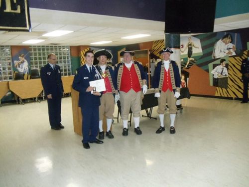 The MOSSAR Color Guard is shown here presenting a Junior Reserve Officer Training Corps Award to Air Force JROTC Cadet Alex Ballard, at Lee's Summit High School, on Monday, April 11, 2011. The MOSSAR Color Guard along with MOSSAR Color Guard Commander Robert Grover, presented Air Force JROTC Cadet Alex Ballard with the J.R.O.T.C. Award.