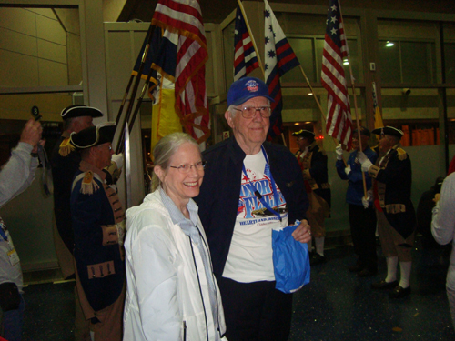 WW II Veteran being greeted after disembarking from the return flight.