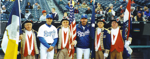 The MOSSAR Color Guard team is shown here with two members of the Kansas City Royals Baseball team prior to the start of the game on Friday, April 26, 2002