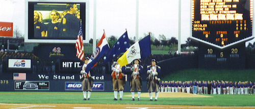 The MOSSAR Color Guard team is shown performing before an audience prior to the start of the Kansas City Royals Baseball game on Friday evening, April 26, 2002.  It is believed to be the first time that the Headquarters Flag has flown before any professional event