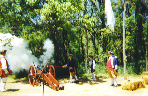 MOSSAR Color Guard team at Pomme de Terre Dam in Hermitage, MO on May 4 -5, 2002.  Shown here, Robert Grover firing a 3 pound cannon; James L. Scott observing